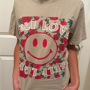 Tan Graphic Tee with Red Smiley Design